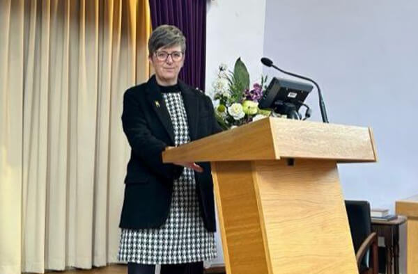 Louise Rooney conducting a personal funeral ceremony as a funeral celebrant in Anglesey